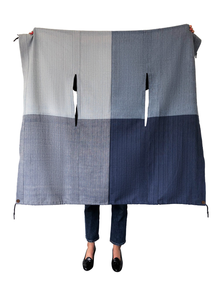 Denim blue cotton cape with buttons and drawcords. Vegan and gender inclusive