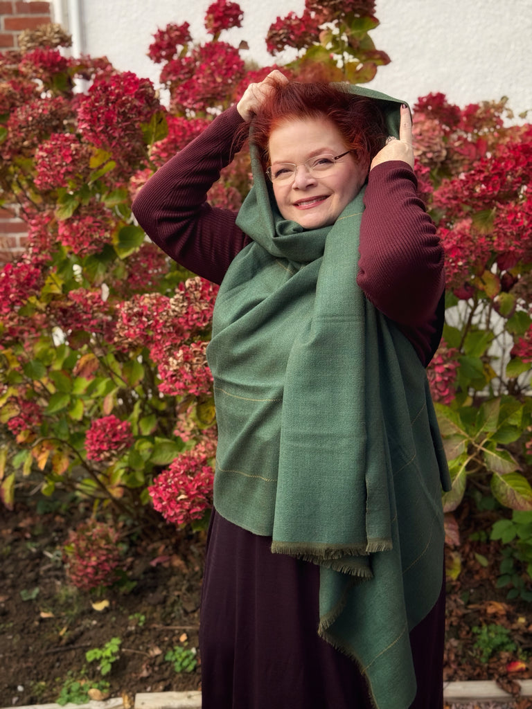 Juniper green free size wool cape worn as a hoodie
