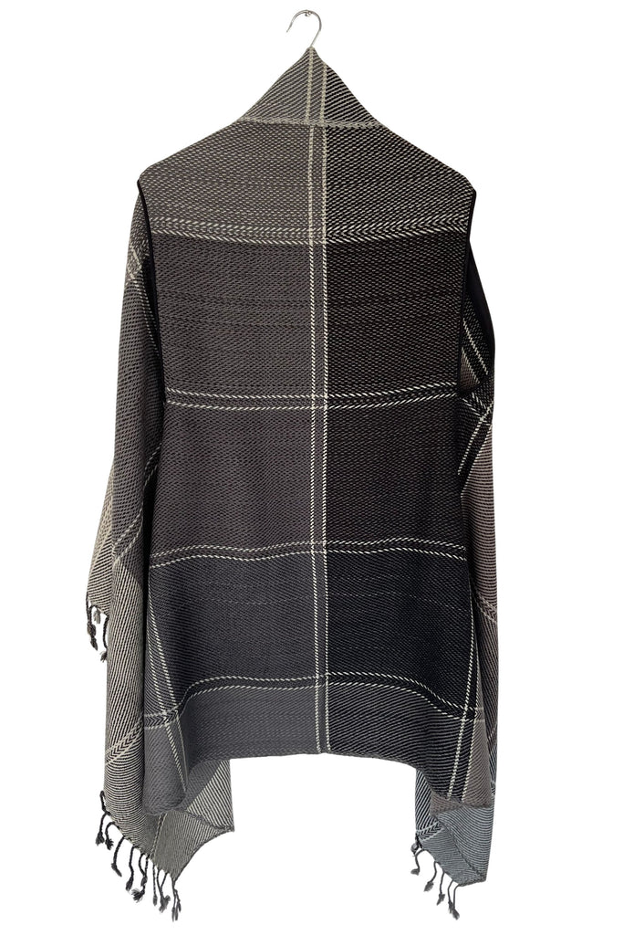A sepia-toned grey wool plaid cape tartan weave with tassles