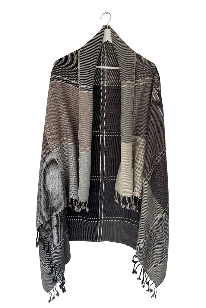 A sepia-toned grey wool plaid cape tartan weave with tassles