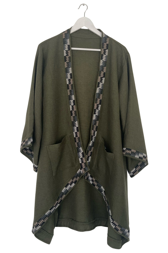 Green kimono-style garment with patterned trim on a white background