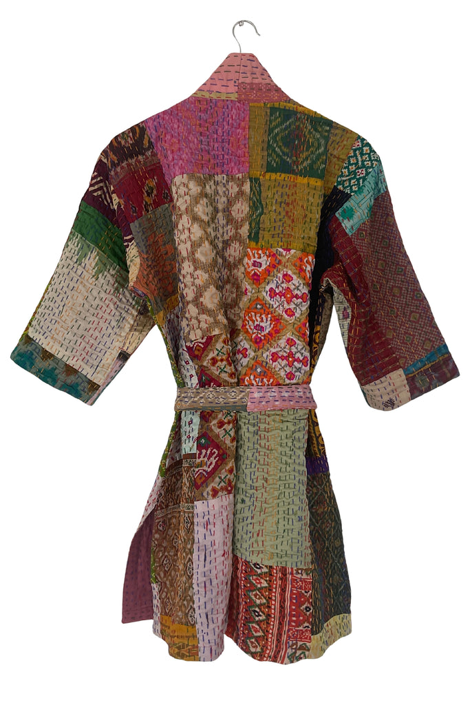 Multicolored patchwork robe on a white background