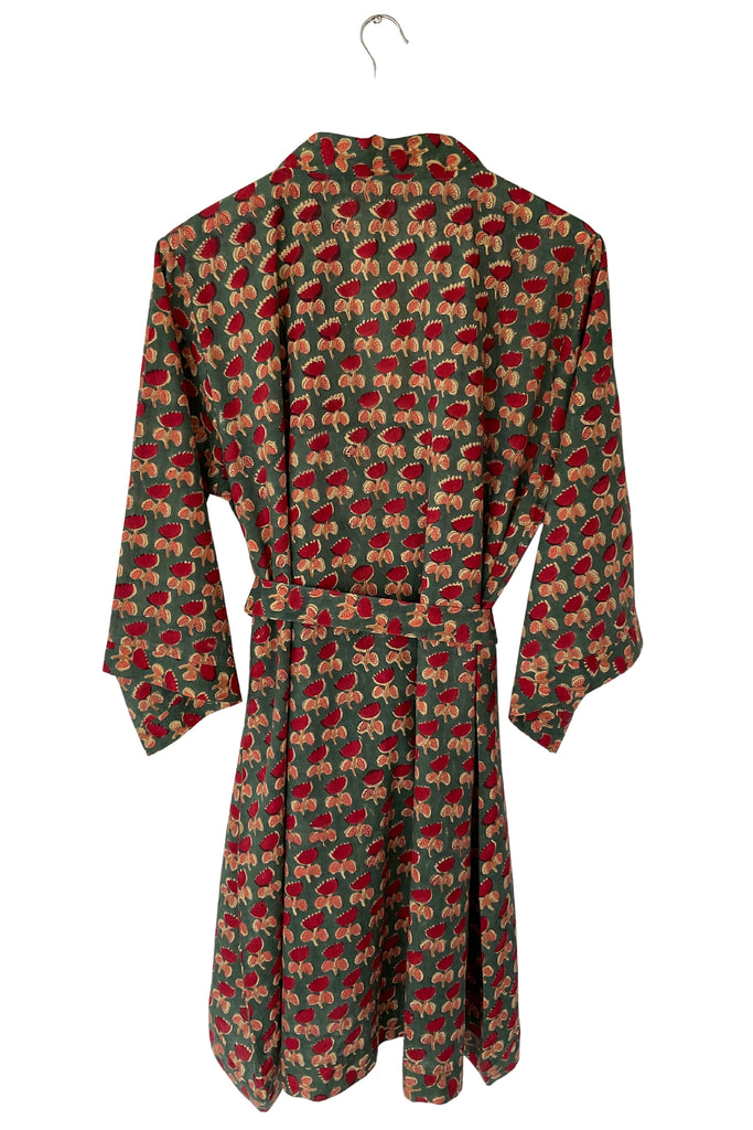 Long-sleeve dress with a pattern of small figures on a white background