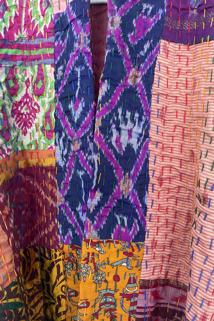 Colorful fabric with various patterns and colors.
