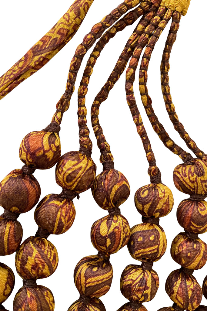 Wooden layered bead necklace covered with silk saris 