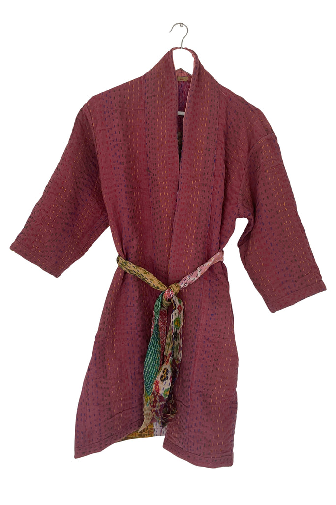 Red robe with a colorful belt on a white background