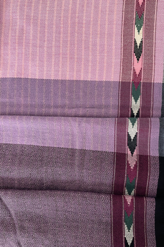 Close-up of a folded fabric with purple and pink plaid pattern