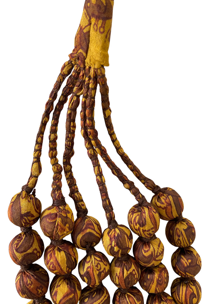 Wooden layered bead necklace covered with silk saris 