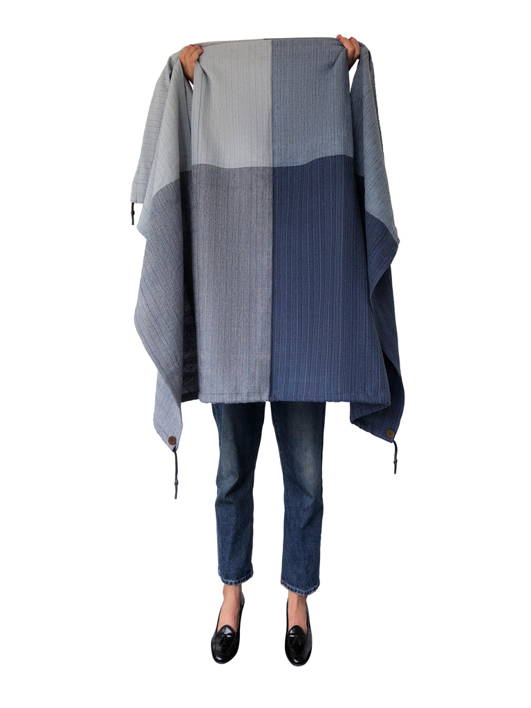 Denim blue cotton cape with buttons and drawcords. Vegan and gender inclusive