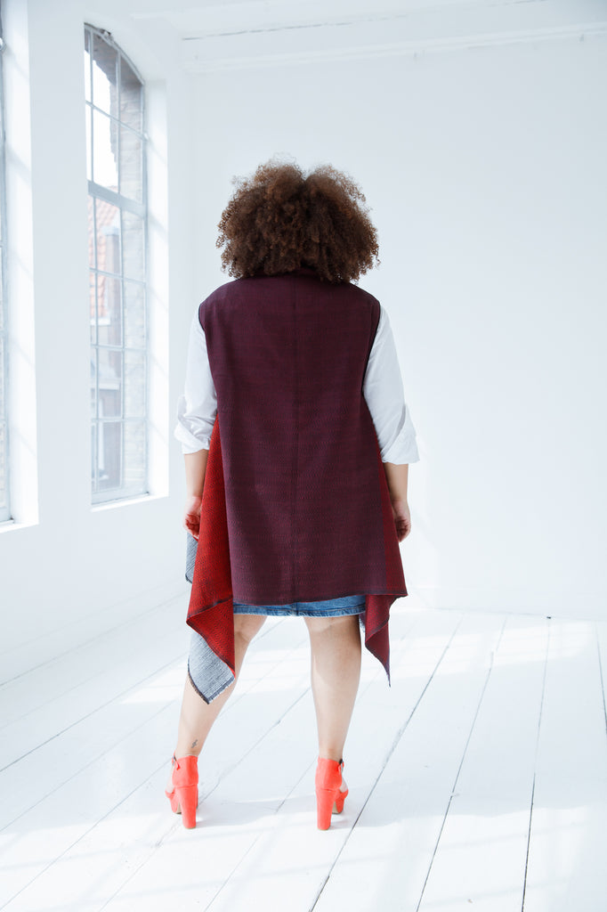 Versatile and sustainable wool cape by julahas in shades of stylish red