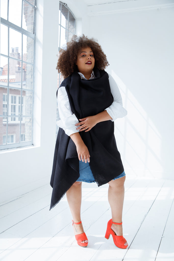 All black sustainable wool cape by julahas. Wear it in different ways