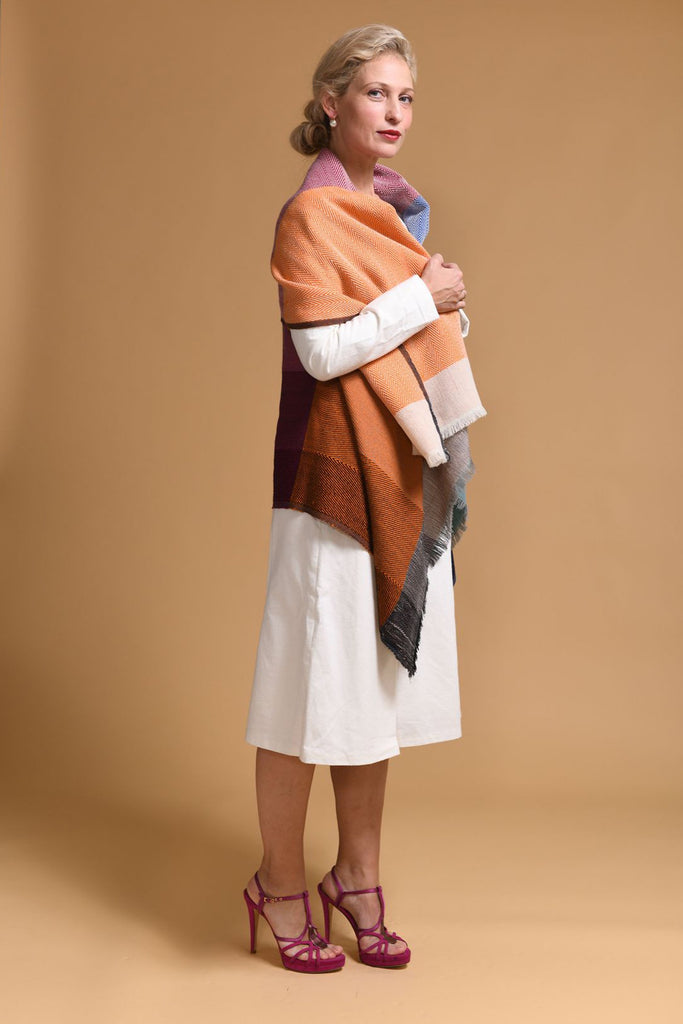 Model wearing the stylish wool JULAHAS poncho  vest-Daria Cape Ganges 