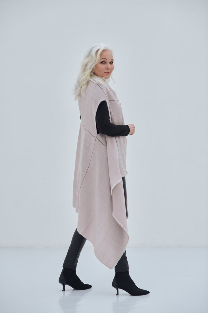 Model looking chic in the soft pink fine wool CELESTIAL Cape Venus - JULAHAS