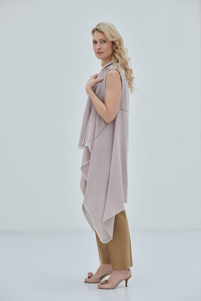 Model wears the soft pink fine wool CELESTIAL Cape Venus - JULAHAS