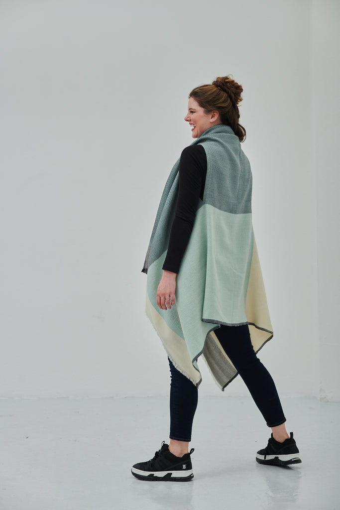 Julahas luxury women's poncho cape in pure wool to be styled in 15-in-one ways and perfect as a warm sylish sustainable clothing item for layering